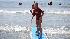 Enthusiastic campers take to the waves off the...