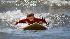 Enthusiastic campers take to the waves off the...