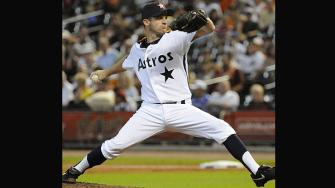 Houston Astros starter Roy Oswalt delivers a pitch in the first inning of a baseball game against the Cincinnati Reds, Saturday, July 24, 2010, in Houston. (AP Photo/Pat Sullivan)