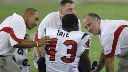 Houston Texans trainers attend to Ben Tate during the fourth quarter of an NFL preseason football game against the Arizona Cardinals Saturday, Aug. 14, 2010 in Glendale, Ariz. The Cardinals won 19-16. (AP Photo/Paul Connors)