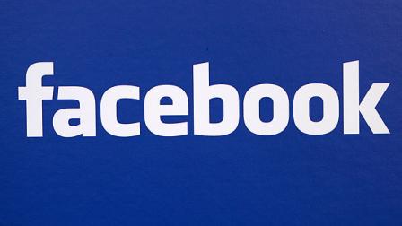 The Facebook logo is displayed as Facebook CEO Mark Zuckerberg speaks to press and advertising partners at a Facebook announcement in New York, Monday, November 6, 2007. (AP Photo/Craig Ruttle)