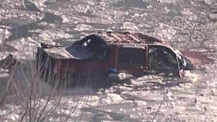 This frame grab from KOTV video in Tulsa, Okla., shows a crew rescuing people that were trapped in a vehicle that plummeted from a bridge into the Spring River, Thursday, Feb. 3, 2011, near Miami, Okla. Oklahoma authorities say the pickup truck, carrying as many as eight people, drove off of snow-covered Interstate 44 and into the river. (AP Photo/Courtesy KOTV, Tulsa)