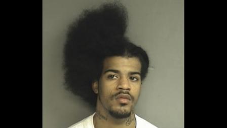 This Tuesday, March 8, 2011 booking photo released by the Stamford, Conn., Police shows David C. Davis, 21, of New Haven, Conn., who was arrested Tuesday and charged with slashing another man in the back while he was in the middle of a haircut. (AP Photo/Stamford Police Department)