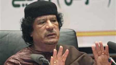 Libyan leader Moammar Gadhafi talks during a celebrations marking the 31-year anniversary of the declaration of the Jamahiriya, or rule of the masses in Sirte, Libya, Sunday, March 2, 2008. In his drive to spread Libyan and Islamic influence in Africa, Gadhafi inaugurates a huge new Gadhafi Mosque Wednesday March 19, 2008 in predominantly Christian Uganda with several African heads of states attending and some 80 Arab journalists flown-in specially from Cairo for the occasion. (AP Photo/Abdel Magid Al Fergany)