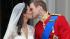 Britain's Prince William kisses his wife Kate, Duchess of Cambridge on the balcony of Buckingham Palace after the Royal Wedding in London Friday, April, 29, 2011. (AP Photo/Matt Dunham)