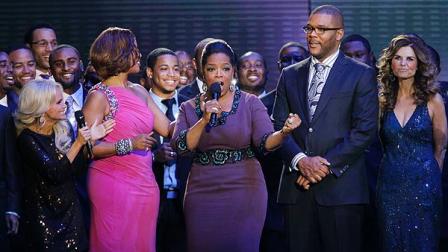 Oprah Winfrey talks as she is surrounded by Kristin Chenoweth, left, Gayle King, Tyler Perry and Maria Shriver, right, during a star-studded double-taping of Surprise Oprah! A Farewell Spectacular, Tuesday, May 17, 2011, in Chicago. The Oprah Winfrey Show is ending its run May 25, after 25 years, and millions of her fans around the globe are waiting to see how she will close out a show that spawned a media empire. (AP Photo/Charles Rex Arb)