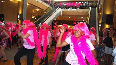 Breast cancer survivors broke out in dance at the Galleria on Saturday to a live performance by Gloria Gaynor of her hit disco single I Will Survive