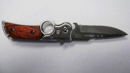 U.S. Customs and Border Protection officers say switchblade knives, stun guns, brass knuckles and batons were tightly packed in the middle of a 40-foot shipping container. These weapons were listed as toys and household items.