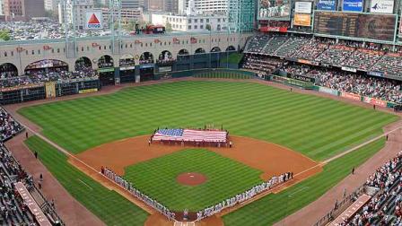 In this file photo, the St. Louis Cardinals, left, and the Houston Astros line up for the national anthem at the Astros baseball season home opener Monday, April 7, 2008, in Houston. (AP Photo/Pat Sullivan)