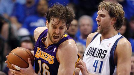 Los Angeles Lakers Pau Gasol, left, works against Dallas Mavericks Dirk Nowitzki during the second half of Game 3 of a second-round NBA playoff basketball series, Friday, May 6, 2011, in Dallas. (AP Photo/Tony Gutierrez)