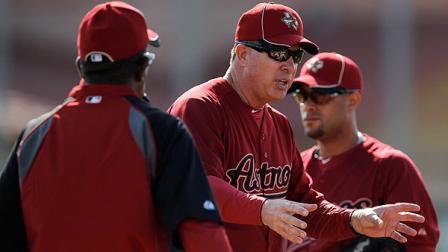 Houston Astros minor league field coordinator Paul Runge, center, talks to pitchers during spring training baseball, Wednesday, Feb. 22, 2012, in Kissimmee, Fla. (AP Photo/Julio Cortez)