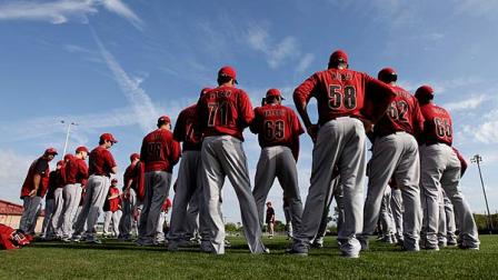 Members of the Houston Astros pitching staff gather on a practice field during spring training baseball, Wednesday, Feb. 22, 2012, in Kissimmee, Fla. (AP Photo/Julio Cortez)