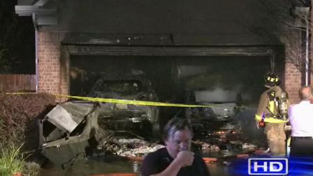The fire destroyed at least two vehicles and seriously damaged the garage.