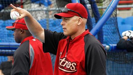 Houston Astros manager Brad Mills signals to one of his fielders before the Astros spring training baseball game against the Toronto Blue Jays in Dunedin, Fla., Saturday, March 10, 2012. (AP Photo/Kathy Willens)