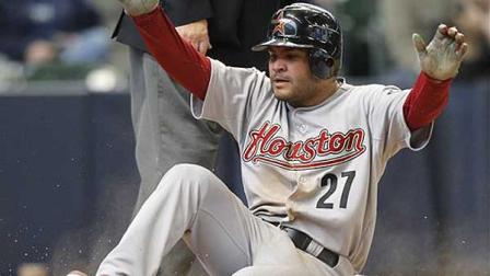 Houston Astros Jose Altuve scores on an RBI single by the Astros J.D. Martinez during the eighth inning of a baseball game against the Milwaukee Brewers, Wednesday, April 25, 2012, in Milwaukee. (AP Photo/Jeffrey Phelps)