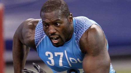 Illinois defensive lineman Whitney Mercilus runs a drill at the NFL football scouting combine in Indianapolis on Monday, Feb. 27, 2012. (AP Photo/Dave Martin)