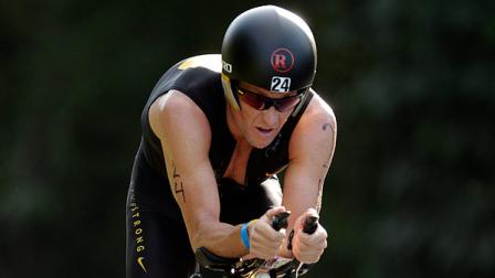 Lance Armstrong competes in the Ironman Panama 70.3. triathlon in Panama City, Sunday Feb. 12, 2012. The race consists of a 1.2-mile swim, a 56-mile bike ride and a 13.1-mile run. (AP Photo/Arnulfo Franco)