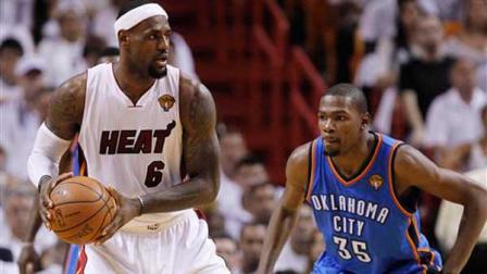 Miami Heat small forward LeBron James (6) is defended by Oklahoma City Thunder small forward Kevin Durant (35)during the second half at Game 4 of the NBA finals basketball series, Tuesday, June 19, 2012, in Miami. (AP Photo/Lynne Sladky)