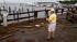 Mark Mitchell surveys the damage to boats at the...