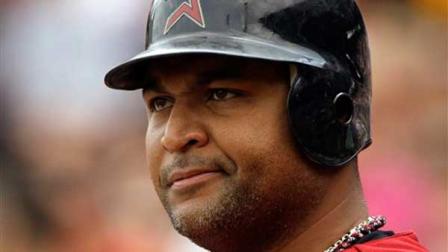 Houston Astros Carlos Lee waits on deck during the first inning of a baseball game against the Pittsburgh Pirates in Pittsburgh Wednesday, July 4, 2012. The Pirates won 6-4, and it was announced that Lee was traded to the Miami Marlins.(AP Photo/Gene J. Puskar)