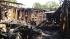 An elderly woman dies when her house goes up in...