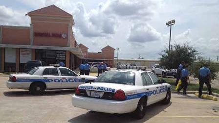 Police at the scene of a shootout outside a north Houston game room