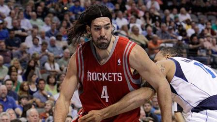Houston Rockets Luis Scola (4) drives past Dallas Mavericks forward Shawn Marion in the second half of an NBA basketball game Tuesday, March 27, 2012, in Dallas. Scola had a team-high 22-points. The Mavericks won 90-81. (AP Photo/Tony Gutierrez)
