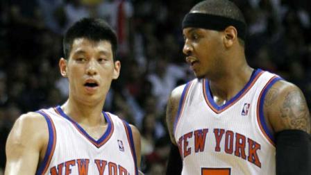 New York Knicks guard Jeremy Lin (17) and teammate Carmelo Anthony (7) talk during the first half of an NBA basketball game against the Miami Heat, Thursday, Feb. 23, 2012, in Miami. (AP Photo/Alan Diaz)