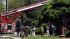 Firefighters and police gather after an...