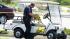 An Aurora Police officer removes crime-scene...