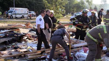Emergency personnel work the scene around a house after an explosion on Tuesday, July 24, 2012 in Wilson, N.Y. The blast leveled the house killing a girl and injuring her parents and two siblings, authorities said. Sarah Johnsons body was found in the debris at the rear of the home, Niagara County Undersheriff Michael Filicetti said. Authorities werent sure of her age but believe she was between 12 and 14. Filicetti said her parents and two siblings were blown clear and were found in the front yard by the first deputy to arrive on the scene. All four were being treated at a Buffalo hospital for serious injuries, he said. (AP Photo/Stephen M Wallace)