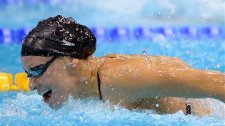 United States Dana Vollmer competes in the womens 100-meter butterfly swimming final at the Aquatics Centre in the Olympic Park during the 2012 Summer Olympics in London, Sunday, July 29, 2012. Vollmer set a new world record with a time of 55.98 (AP Photo/Mark J. Terrill)