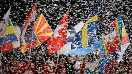Confetti surrounds athletes waving their national flags during the Closing Ceremony at the 2012 Summer Olympics, Sunday, Aug. 12, 2012, in London. (AP Photo/Matt Slocum)