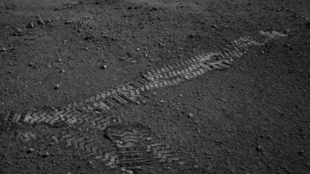 This image dated Wednesday Aug. 22, 2012 and provided by NASA shows the Curiosity rovers wheel tracks on the surface of Mars an image sent from one of the rovers cameras. The image was posted on a Tweet by JPL mission engineer Allen Chen. (AP Photo/NASA)