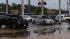 Lines at gas stations wrap around surrounding...