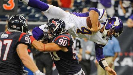Minnesota Vikings quarterback McLeod Bethel-Thompson (4) dives over Houston Texans Shawn Loiseau (90) during the second half of an NFL preseason football game against the Houston Texans, Thursday, Aug. 30, 2012, in Houston. The Texans won 28-24.(AP Photo/Dave Einsel)
