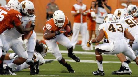 Texas running back Malcolm Brown runs for yardage during the first quarter of an NCAA college football game against Wyoming, Saturday, Sept. 1, 2012, in Austin, Texas.(AP Photo/Jack Plunkett)