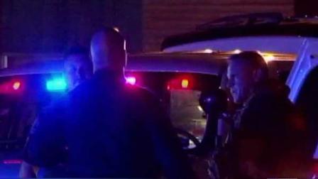 Officers discuss the sutuation at a SWAT scene in northeast Harris County