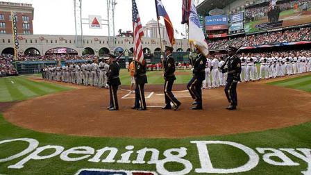 In this file photo, an honor guard carries the flags during opening day ceremonies before a baseball game between the Houston Astros and Colorado Rockies on Friday, April 6, 2012, in Houston. (AP Photo/Pat Sullivan)