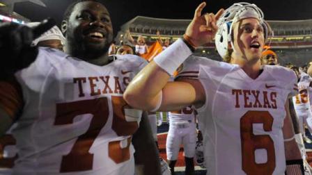 Texas offensive lineman Trey Hopkins (75) and quarterback Case McCoy (6) sing The Eyes of Texas with fans after their NCAA college football game in Oxford, Miss., Saturday, Sept. 15, 2012. No. 14 Texas won 66-31. (AP Photo/Austin McAfee)