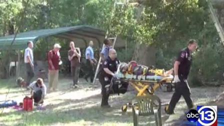 A woman is carried away on a stretcher after being rescued from a tree in Porter. Officials say she was the second person in two days to be rescued from the same tree