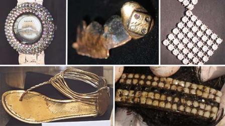 Items found at the scene include: a decorative gold-colored dental work of the upper front teeth (upper middle); a white wristwatch (upper left); a white clip-on earring (upper right); black hair extensions with a purple ponytail holder; and a white and black hairclip (lower right); a gold-colored sandal, size 7 (lower left); Almost Famous brand jean shorts size 5; and a black bra.