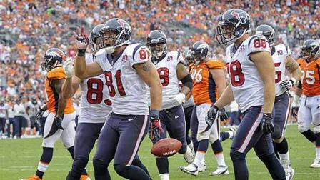 Houston Texans tight end Owen Daniels (81) celebrates with wide receiver Kevin Walter (83), outside linebacker Connor Barwin (98) and tackle Ryan Harris (68) after scoring a touchdown in the third quarter of an NFL football game Sunday, Sept. 23, 2012, in Denver. (AP Photo/Jack Dempsey)