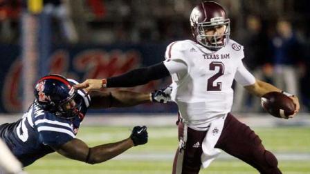 Texas A&M quarterback Johnny Manziel (2) tries to fend off Mississippi defensive end Cameron Whigham (55) during the second quarter of an NCAA college football game in Oxford, Miss., Saturday, Oct. 6, 2012. (AP Photo/Rogelio V. Solis)