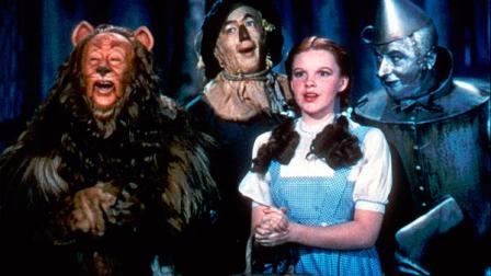 This 1939 photo provided by Warner Bros. shows, from left, Bert Lahr as the Cowardly Lion, Ray Bolger as the Scarecrow, Judy Garland as Dorothy and Jack Haley as the Tin Woodman in a scene from The Wizard of Oz. Judy Garlands original costume from The Wizard of Oz will be up for sale at Juliens Auctions in November 2012. (AP Photo/Warner Bros., File)