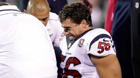 Trainers work on Houston Texans inside linebacker Brian Cushing (56) during the first half of an NFL football game against the New York Jets Monday, Oct. 8, 2012, in East Rutherford, N.J. (AP Photo/Kathy Willens)