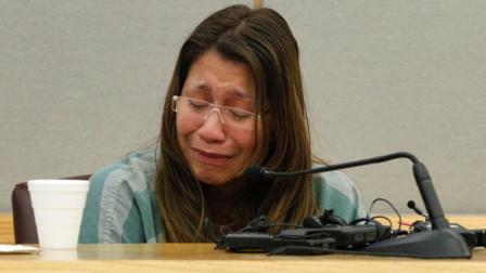 In a Thursday, Oct. 11, 2012 file photo, Elizabeth Escalona, 23, breaks down as she responds to a line of questions in the sentencing phase of her trial, in Dallas. Escalona was sentenced Friday, Oct. 12, 2012 to 99 years in prison for beating her toddler and gluing the childs hands to a wall. (AP Photo/Tony Gutierrez, File)