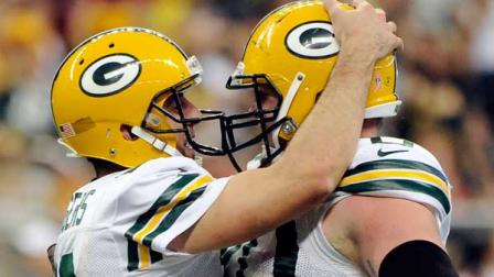 Green Bay Packers quarterback Aaron Rodgers (12) and guard T.J. Lang (70) celebrate a touchdown against the Houston Texans in the fourth quarter of an NFL football game, Sunday, Oct. 14, 2012, in Houston. (AP Photo/Dave Einsel)