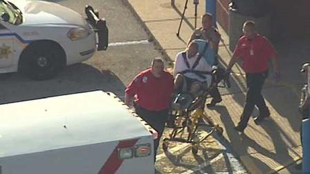 The man police were looking for was hiding under a baby bed at the Babies R Us store. He was reportedly bitten by a police dog.