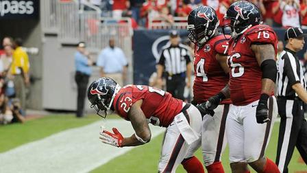 Houston Texans Arian Foster (23), Wade Smith (74) and Duane Brown (76) celebrate a touchdown against the Baltimore Ravens during the fourth quarter of an NFL football game Sunday, Oct. 21, 2012, in Houston. (AP Photo/Dave Einsel)